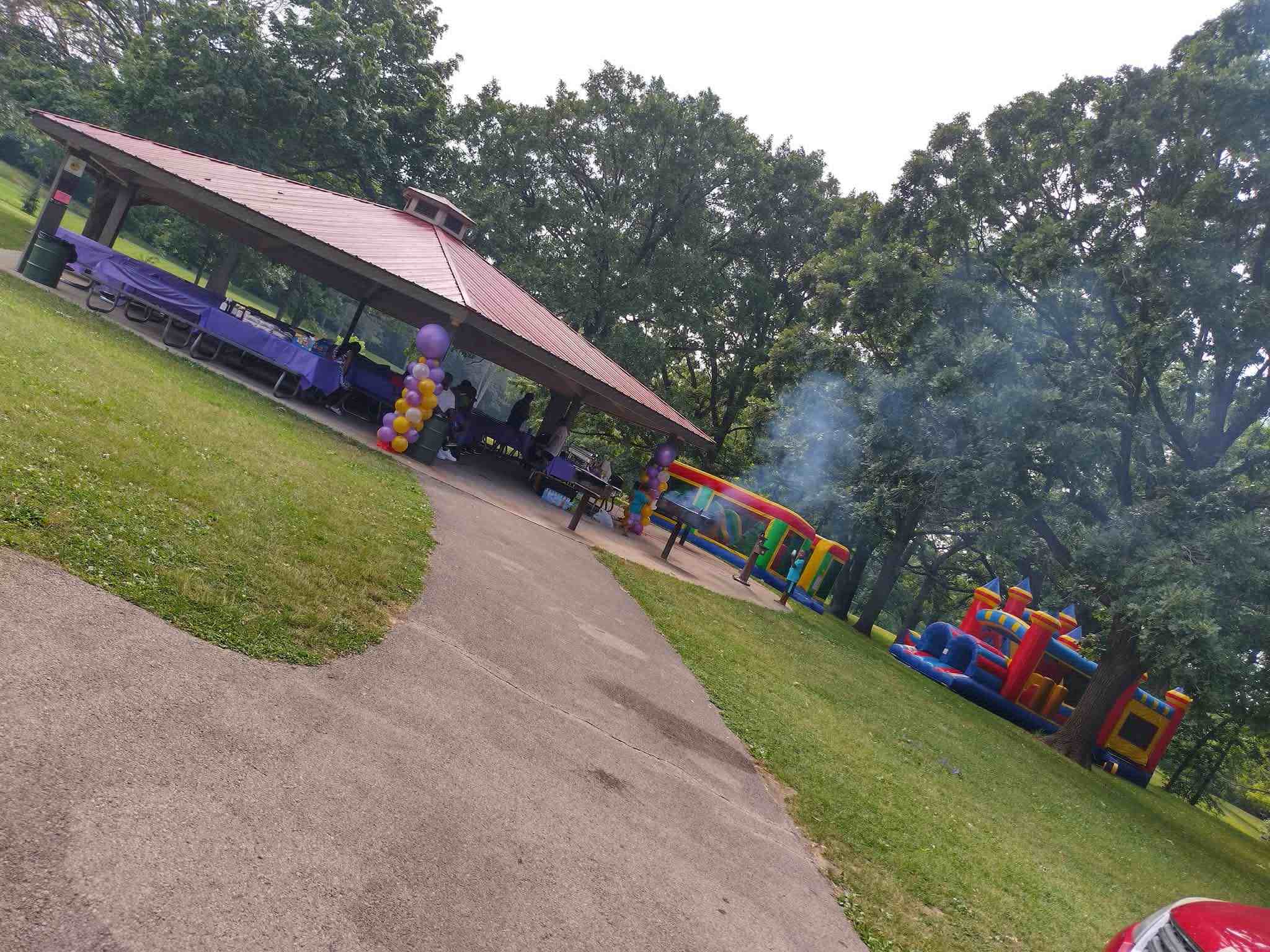 Park birthday party with pavilion and inflatables